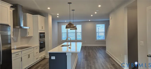 a view of a kitchen cabinets and a wooden floor