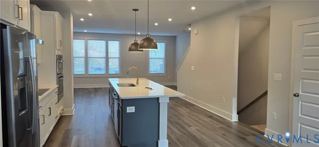 a view of a kitchen cabinets and wooden floor
