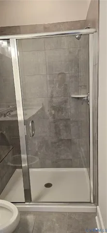 a bathroom with a shower and a bathtub