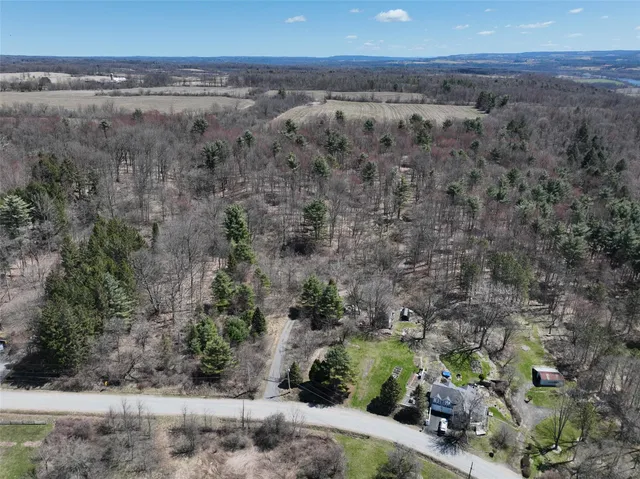 a aerial view of a house with a yard