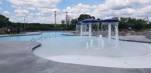 a view of a swimming pool with a patio