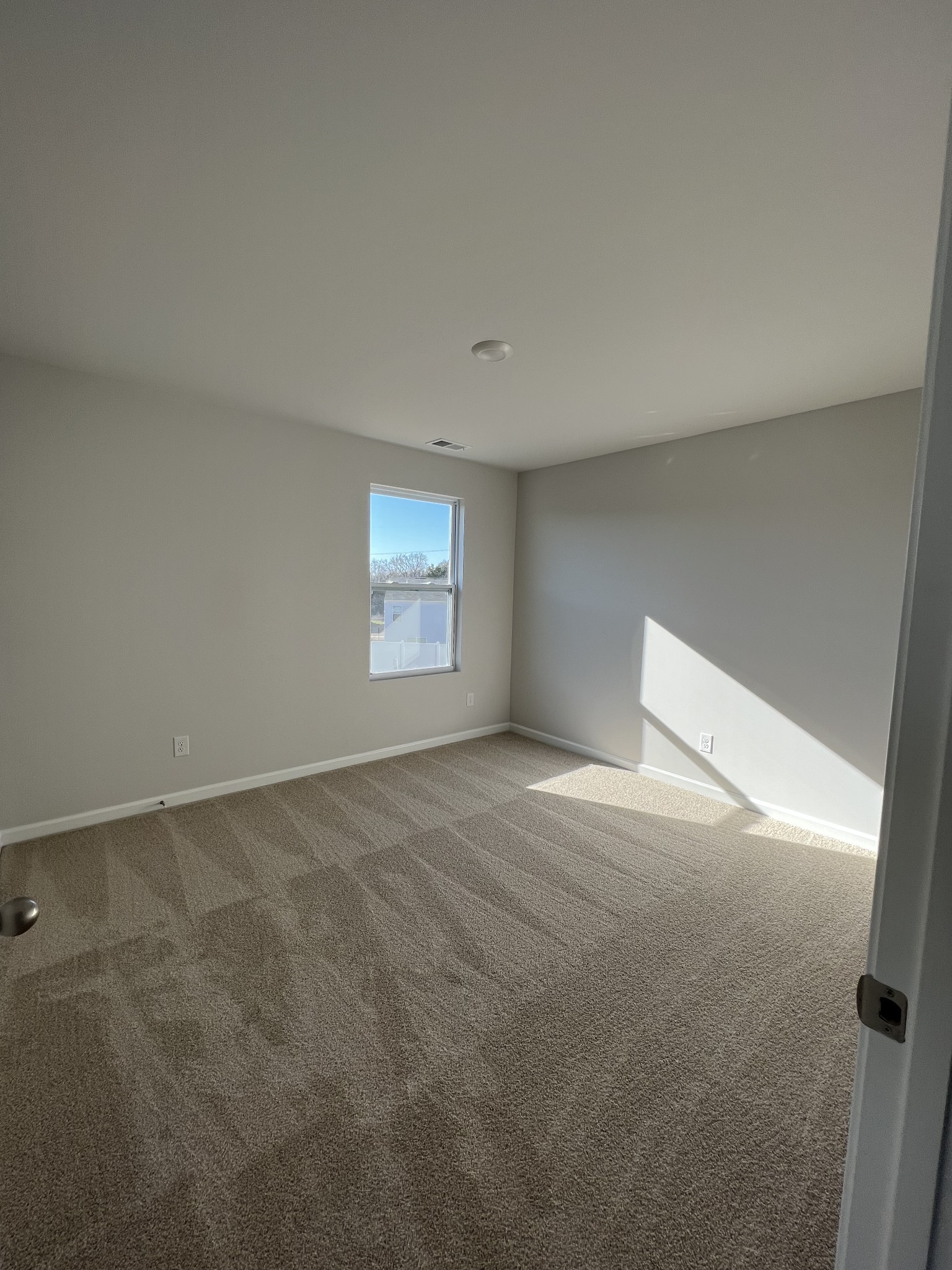 1703 Rylee Way Lebanon, TN 37087 - Photo 9 of 18 a view of an empty room with a window
