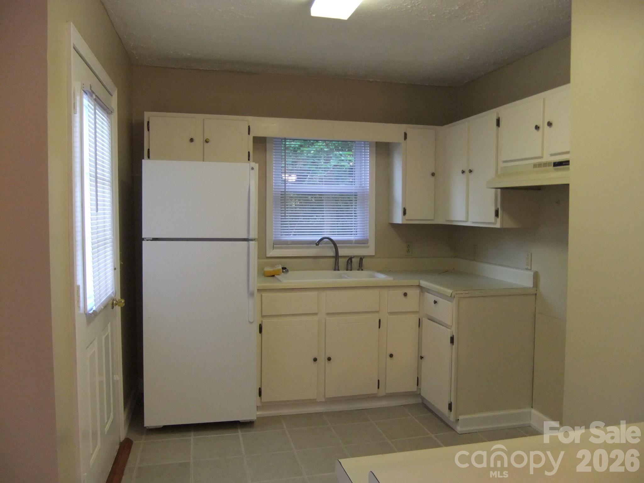 1631 Harris Road Fort Mill, SC 29708 - Photo 13 of 31 a utility room with cabinets washer and dryer