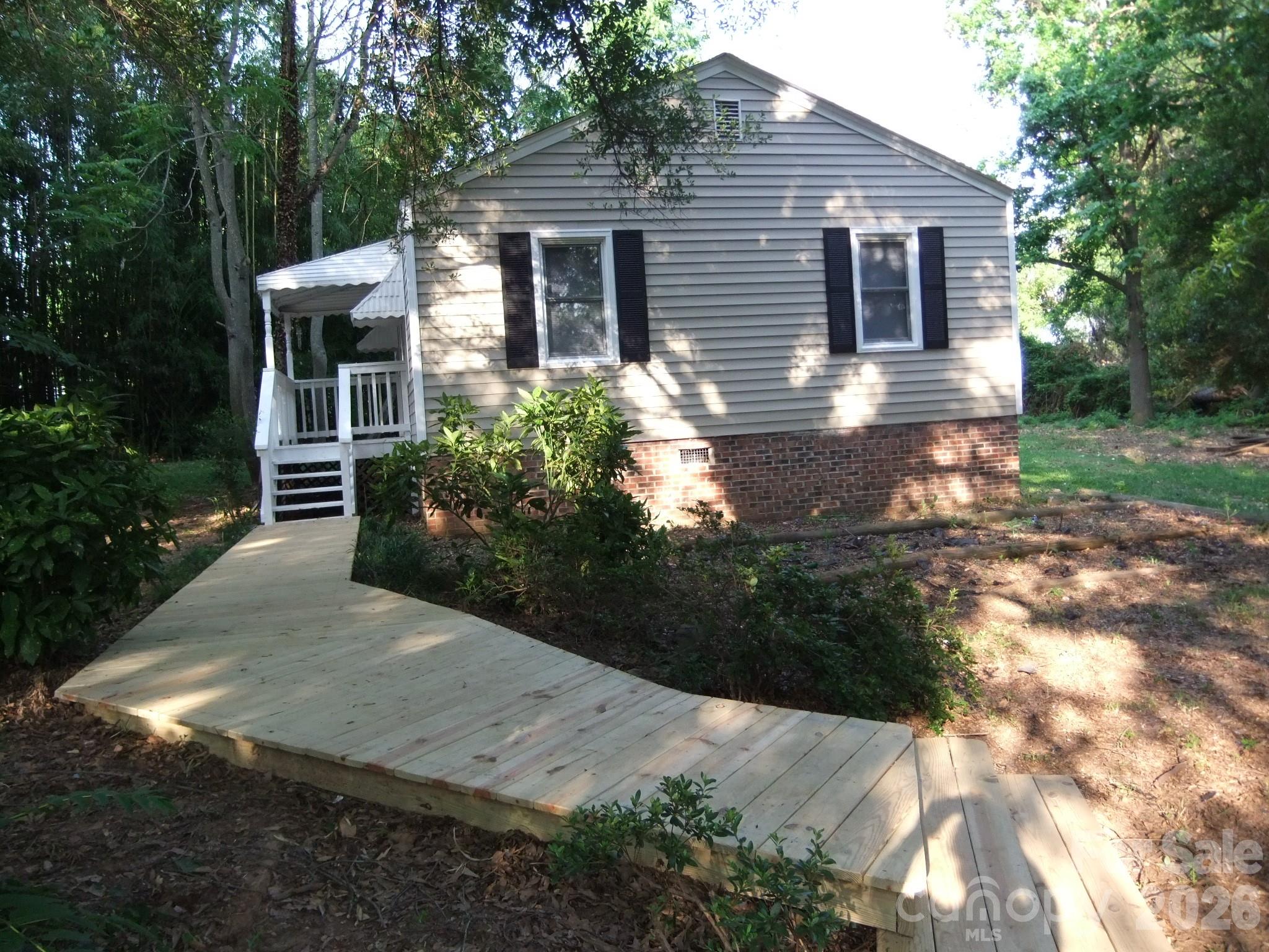 1631 Harris Road Fort Mill, SC 29708 - Photo 2 of 31 a front view of a house with garden