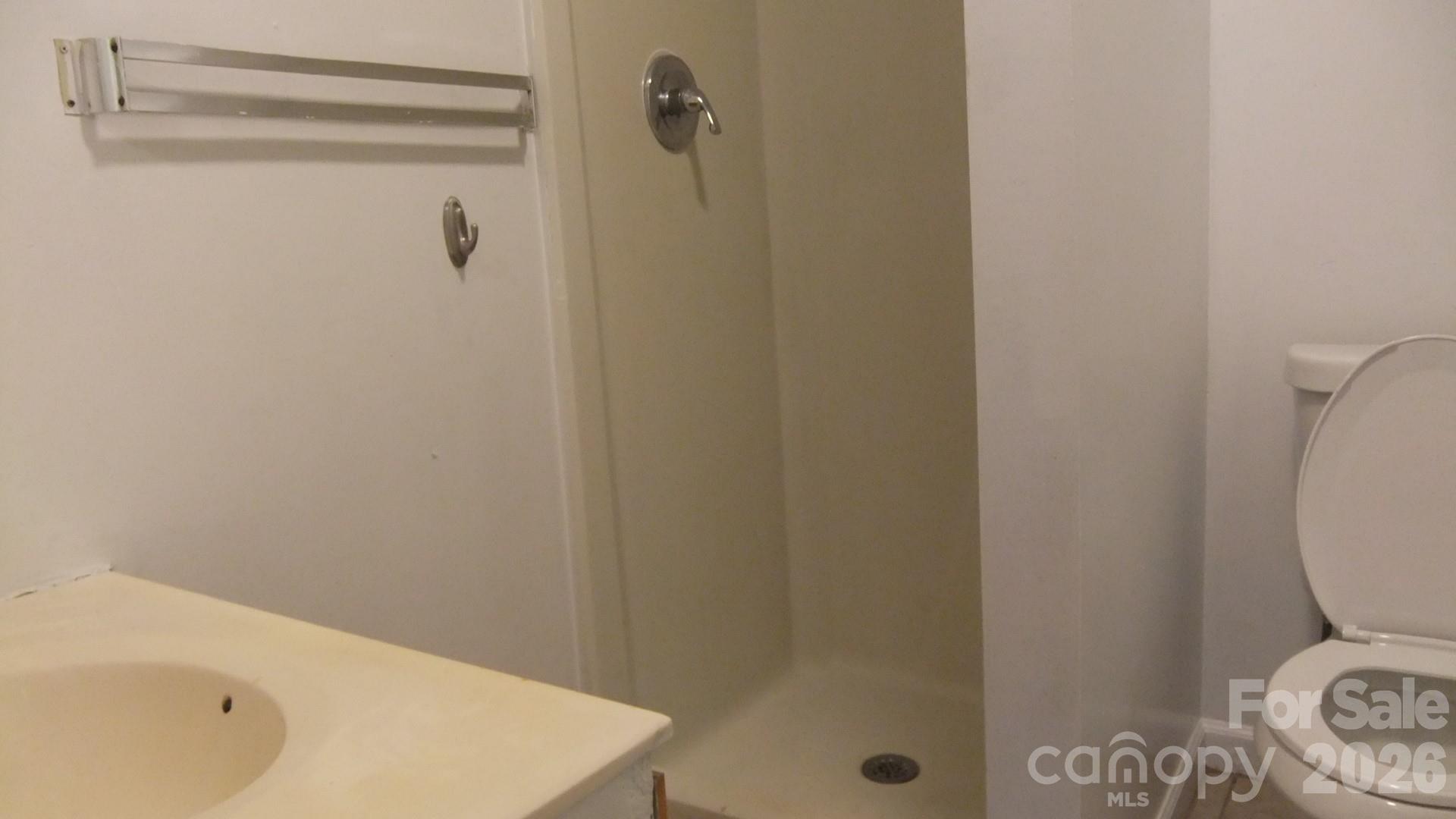 1631 Harris Road Fort Mill, SC 29708 - Photo 25 of 31 a bathroom with a sink a toilet and shower