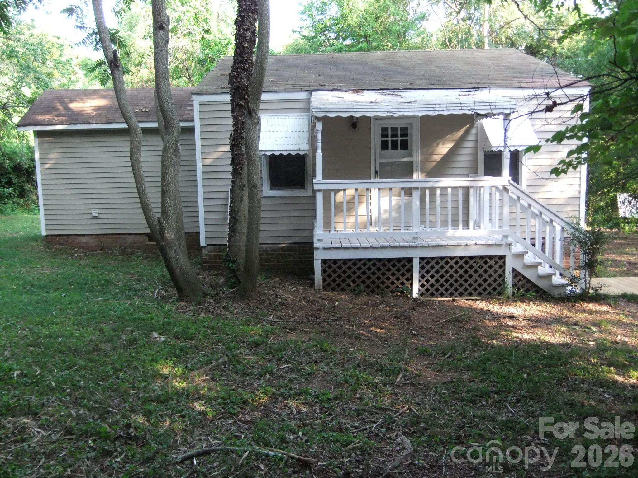 1631 Harris Road Fort Mill, SC 29708 - Photo 3 of 31 a view of a house with a yard and wooden fence