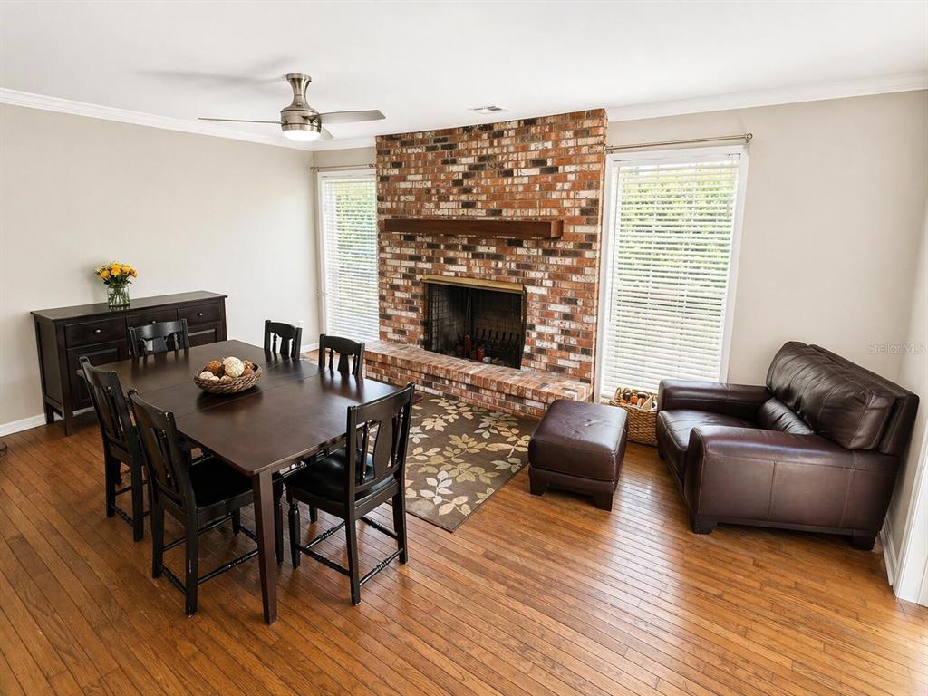 2313 Southeast 7th Street Ocala, FL 34471 - Photo 16 of 54 a living room with furniture and a fireplace
