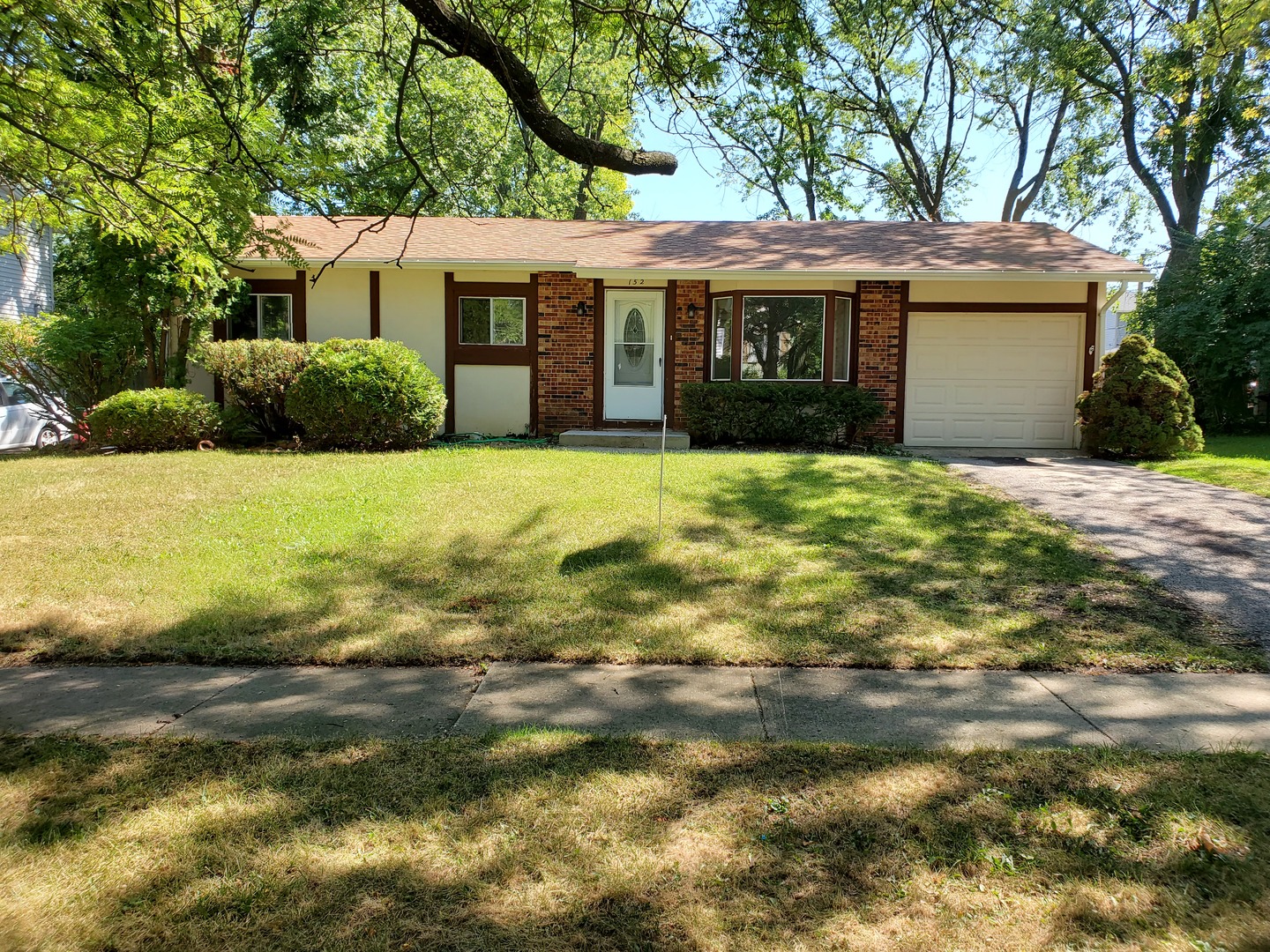 152 Bedford Road Bolingbrook, IL 60440 - Photo 1 of 12 a front view of a house with a garden