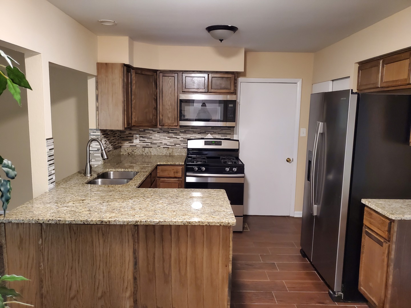 152 Bedford Road Bolingbrook, IL 60440 - Photo 5 of 12 a kitchen with a stove and a refrigerator