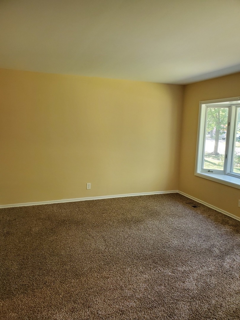 152 Bedford Road Bolingbrook, IL 60440 - Photo 10 of 12 an empty room and window