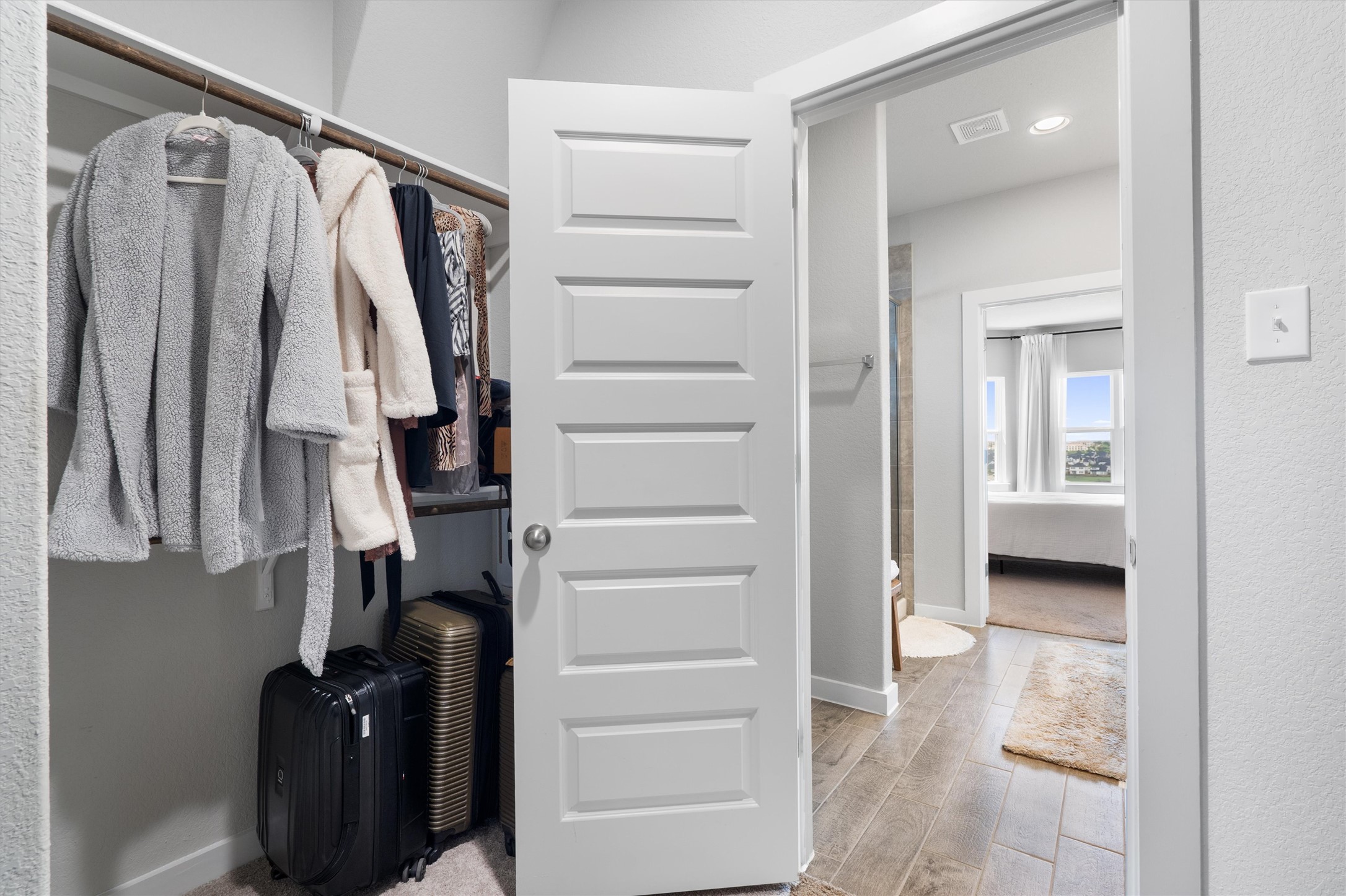 11620 Comano Drive Austin, TX 78747 - Photo 21 of 34 The property features a closet with a hanging rod and shelving, and a paneled white door