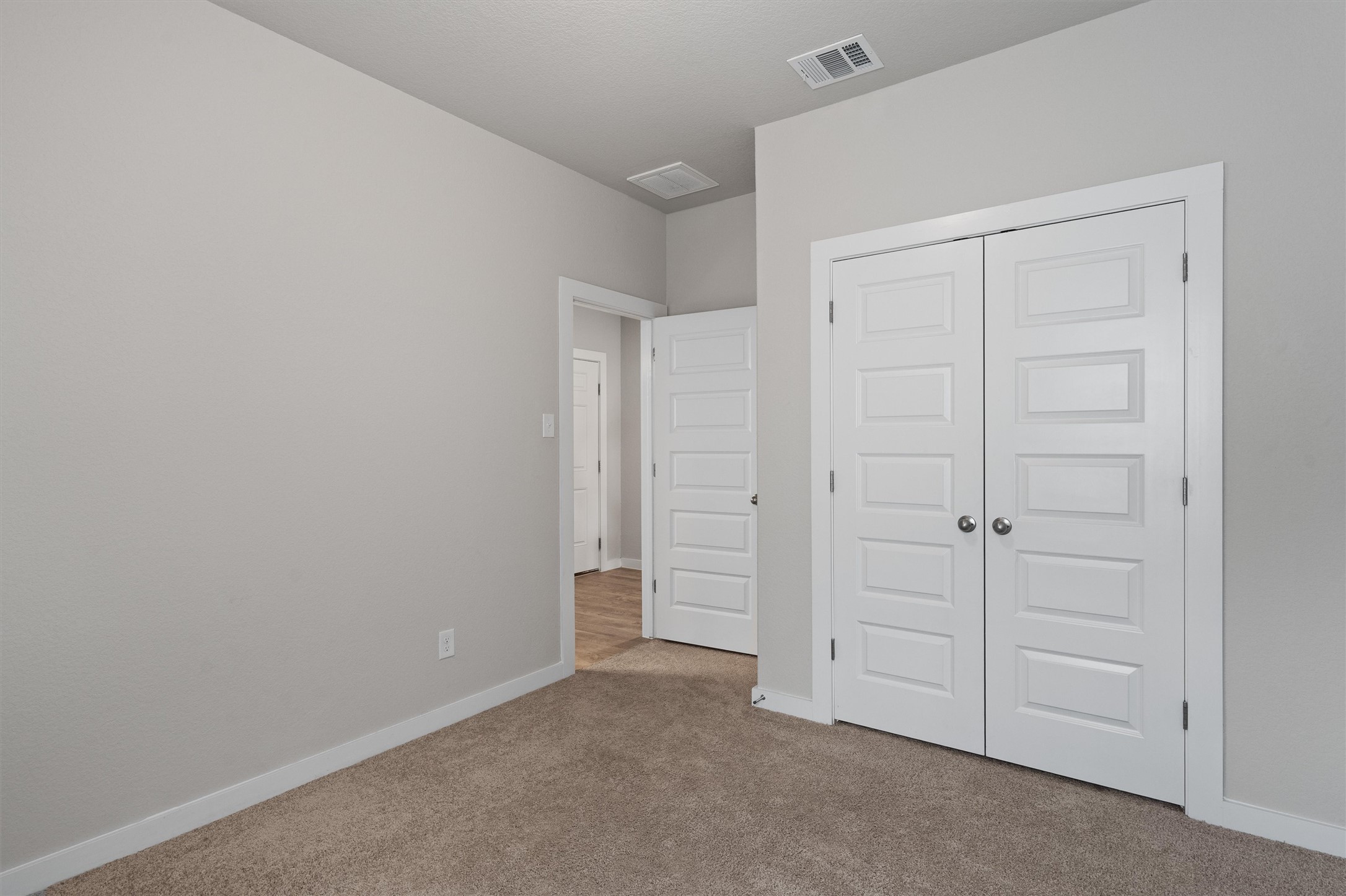 11620 Comano Drive Austin, TX 78747 - Photo 25 of 34 This room features light gray walls, a carpeted floor, and white trim