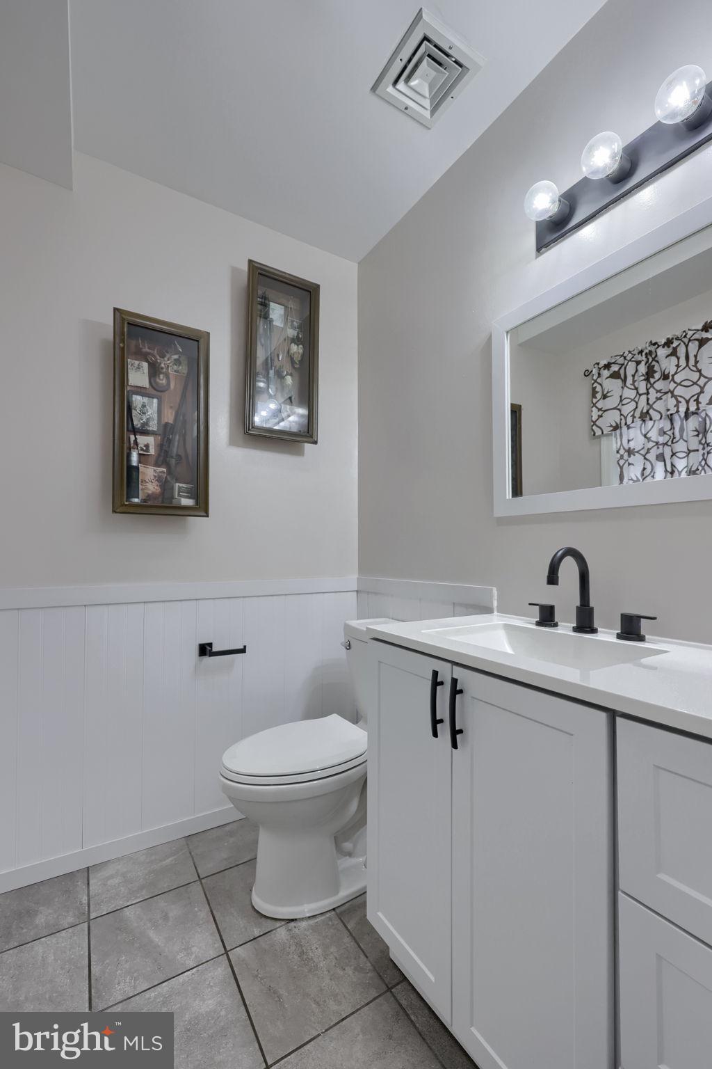 479 Hilldale Road Holtwood, PA 17532 - Photo 11 of 51 a bathroom with a toilet a sink and mirror