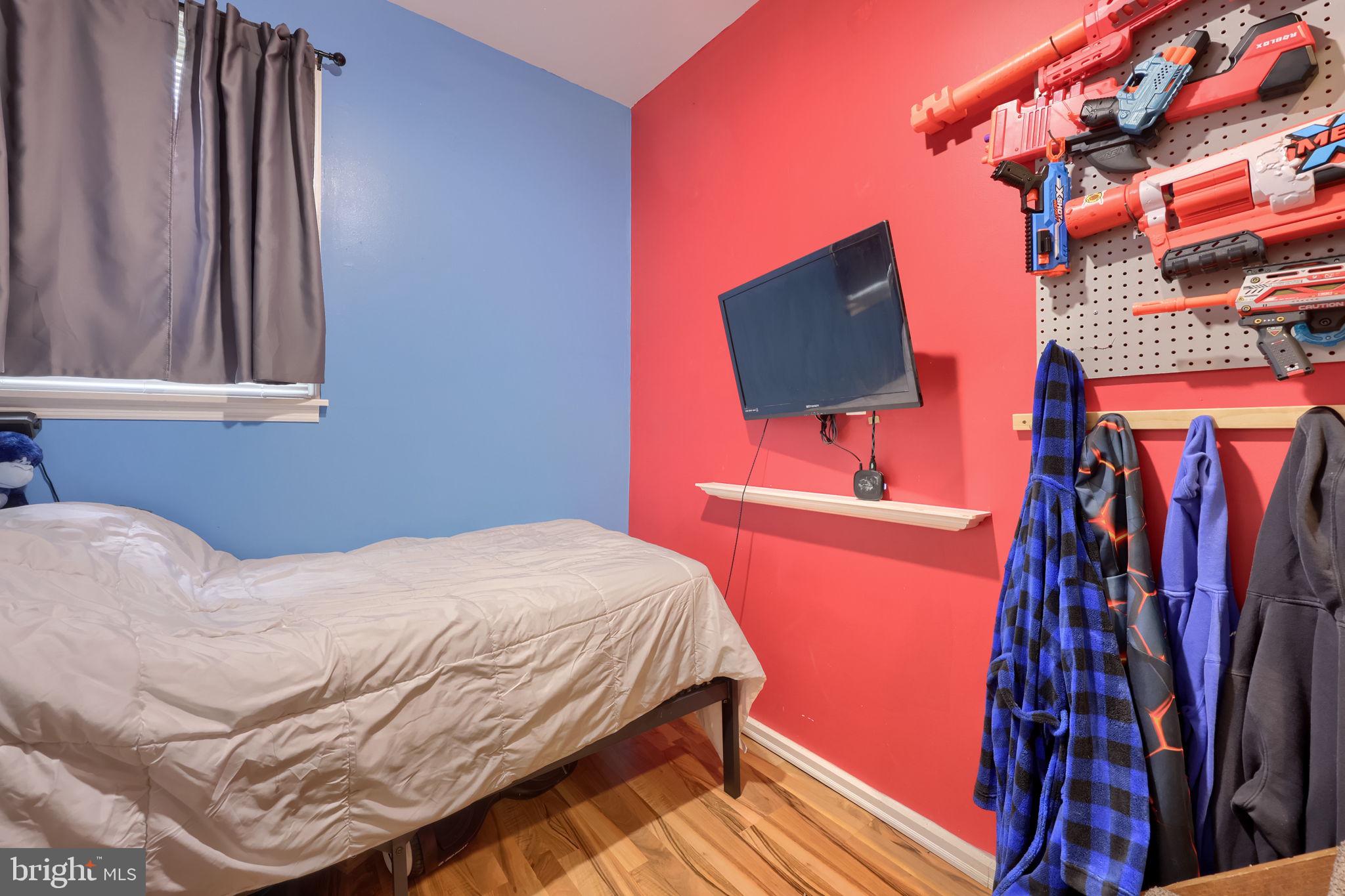 479 Hilldale Road Holtwood, PA 17532 - Photo 15 of 51 a bedroom with a bed and a flat screen tv