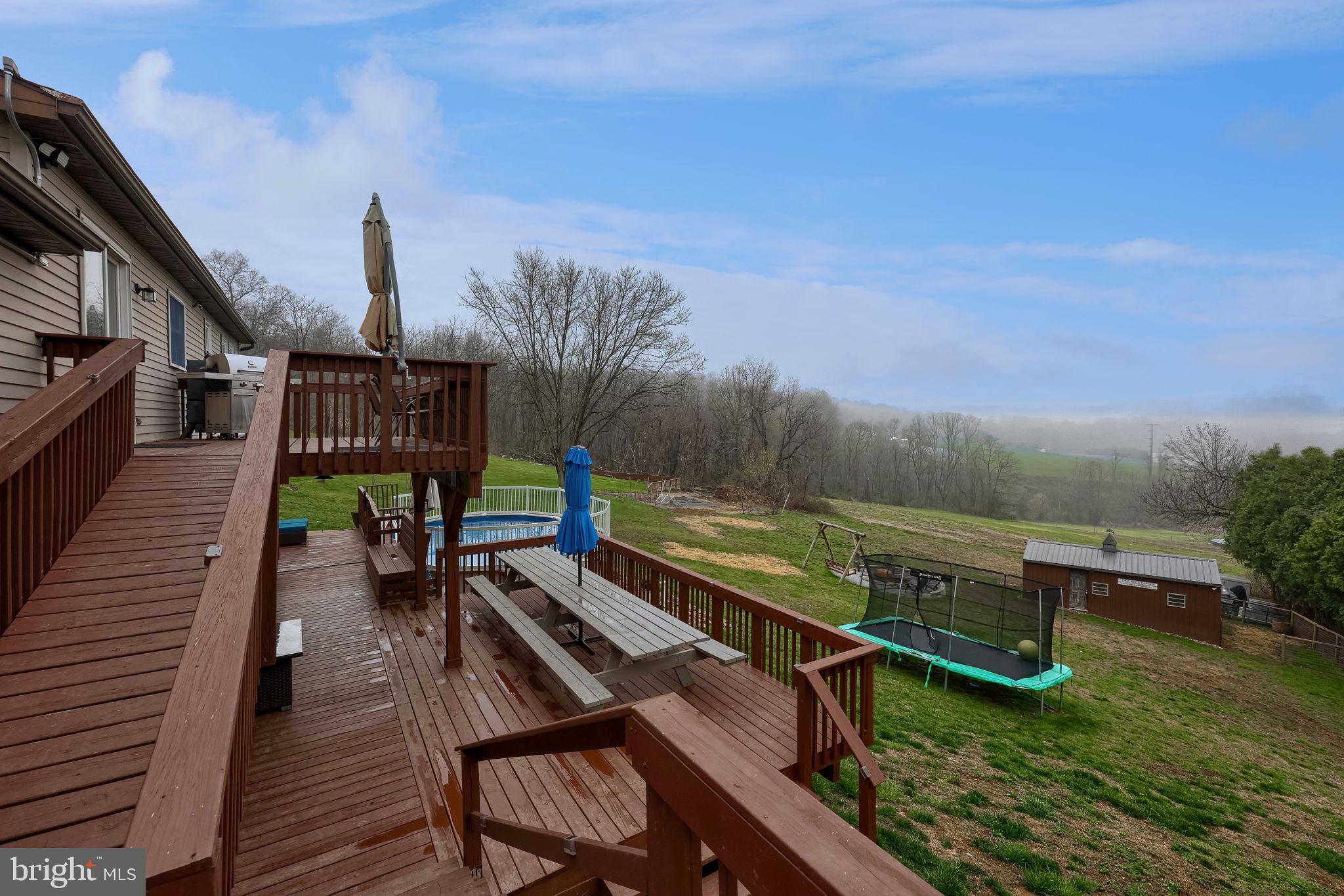 479 Hilldale Road Holtwood, PA 17532 - Photo 23 of 51 a view of a deck with chairs next to a yard