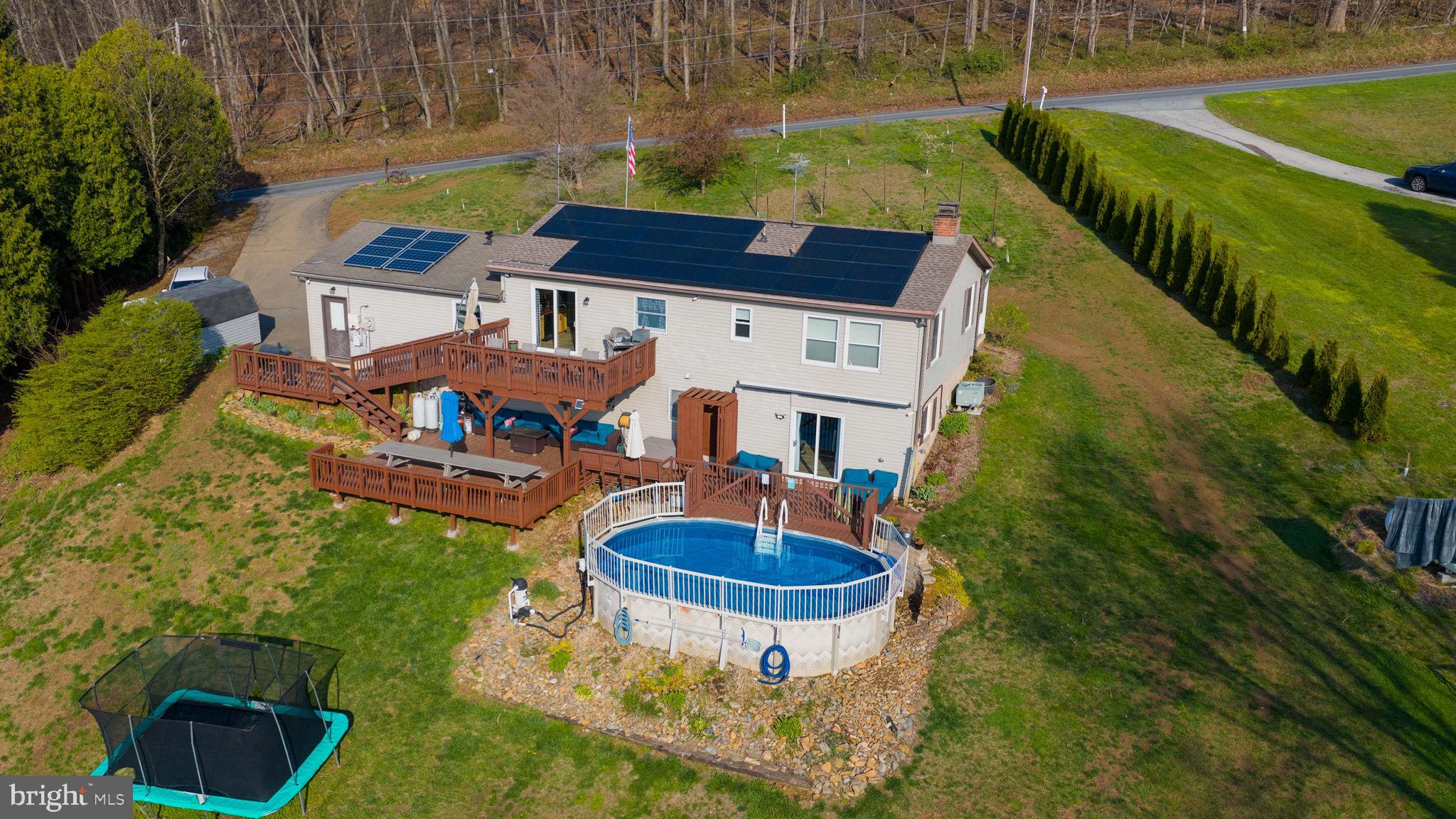 479 Hilldale Road Holtwood, PA 17532 - Photo 48 of 51 a aerial view of a house with swimming pool and a yard