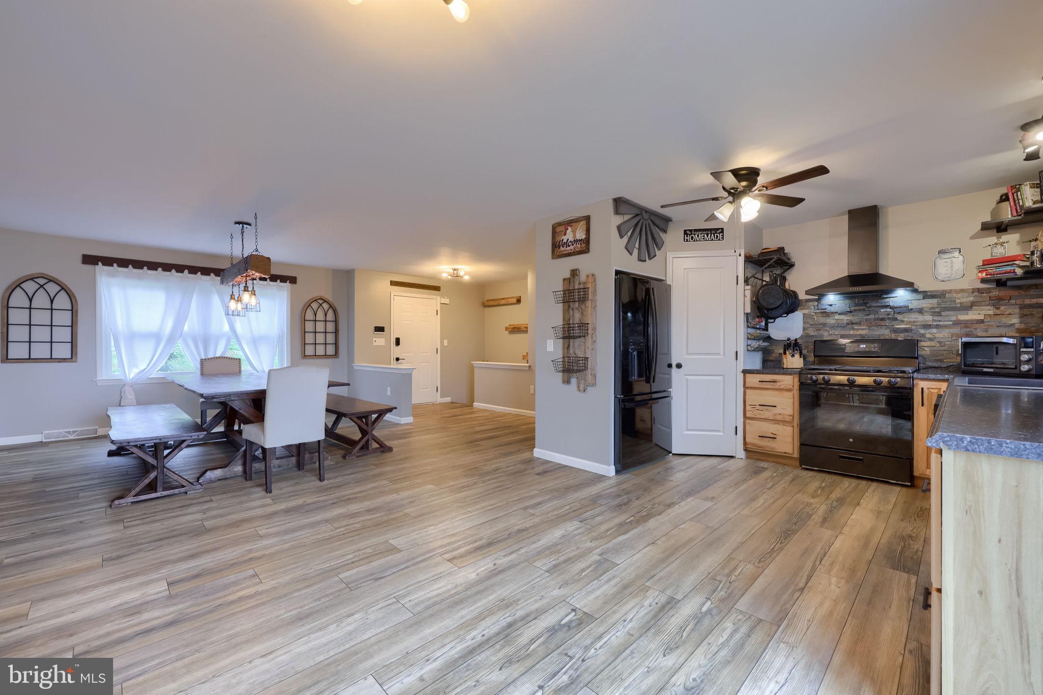 479 Hilldale Road Holtwood, PA 17532 - Photo 5 of 51 a living room with furniture dining table and a fireplace