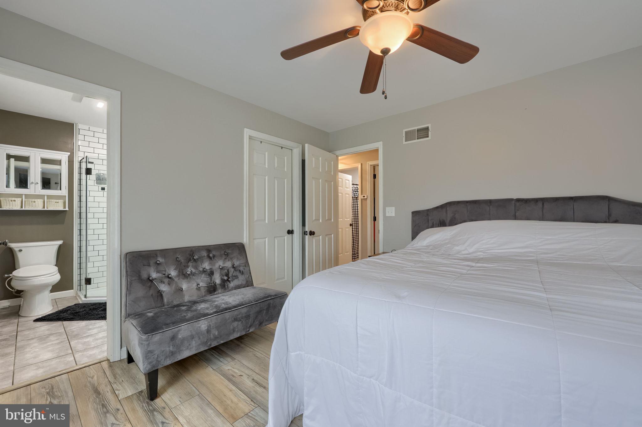 479 Hilldale Road Holtwood, PA 17532 - Photo 9 of 51 a bedroom with a bed couches and view of living room