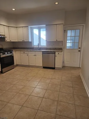 a large kitchen with a stove