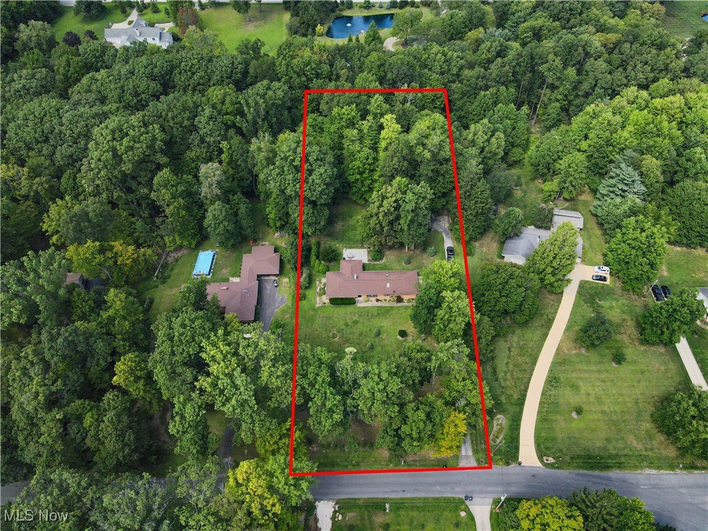 4555 Ranchwood Road Akron, OH 44333 - Photo 38 of 43 Aerial overview of property's location with a nearby body of water and property parcel outlined