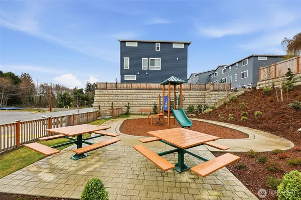 a view of a patio with a table and chairs