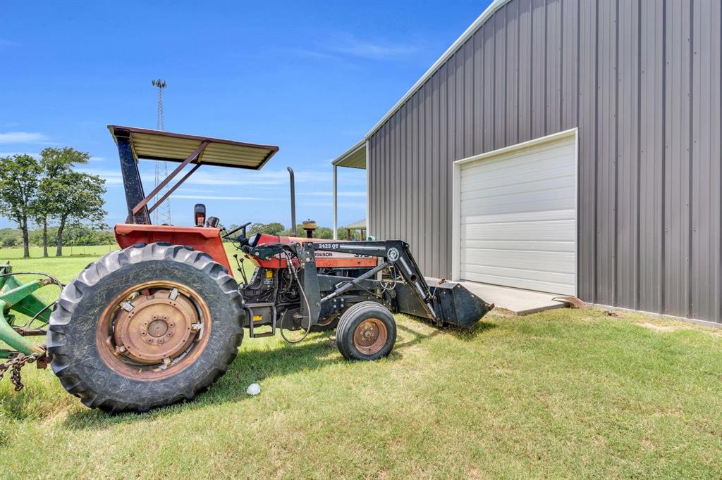1467 Brown Road Palo Pinto, TX 76484 - Photo 11 of 38 a view of a backyard with table and chairs
