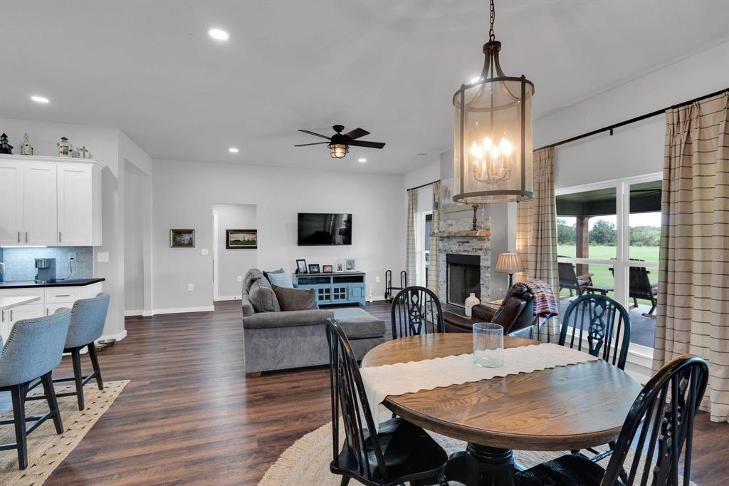1467 Brown Road Palo Pinto, TX 76484 - Photo 22 of 38 a view of a a dining room with furniture window and wooden floor