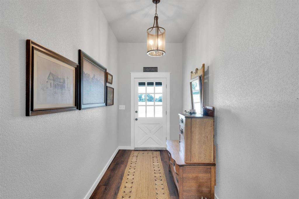 1467 Brown Road Palo Pinto, TX 76484 - Photo 23 of 38 a view of hallway with wooden floor