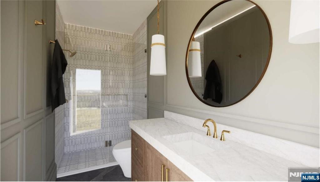 331 Lockwood Drive Paramus, NJ 07652 - Photo 19 of 33 a bathroom with a sink and a mirror