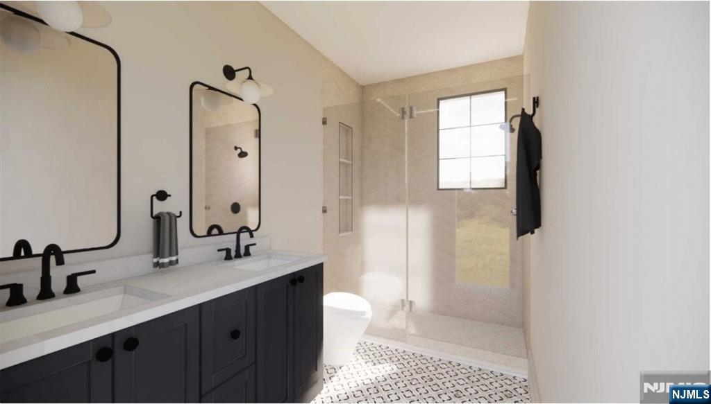 331 Lockwood Drive Paramus, NJ 07652 - Photo 22 of 33 a bathroom with a sink a toilet and shower