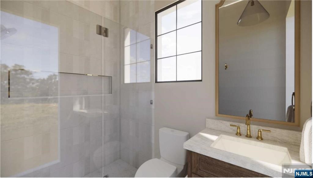 331 Lockwood Drive Paramus, NJ 07652 - Photo 25 of 33 a bathroom with a sink toilet and shower