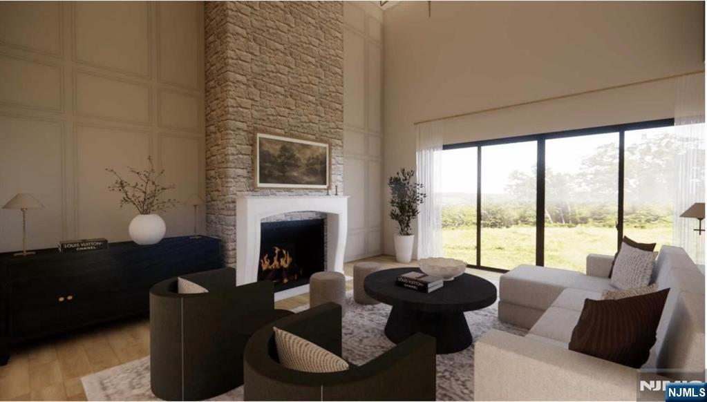 331 Lockwood Drive Paramus, NJ 07652 - Photo 6 of 33 a living room with furniture fireplace and a large window