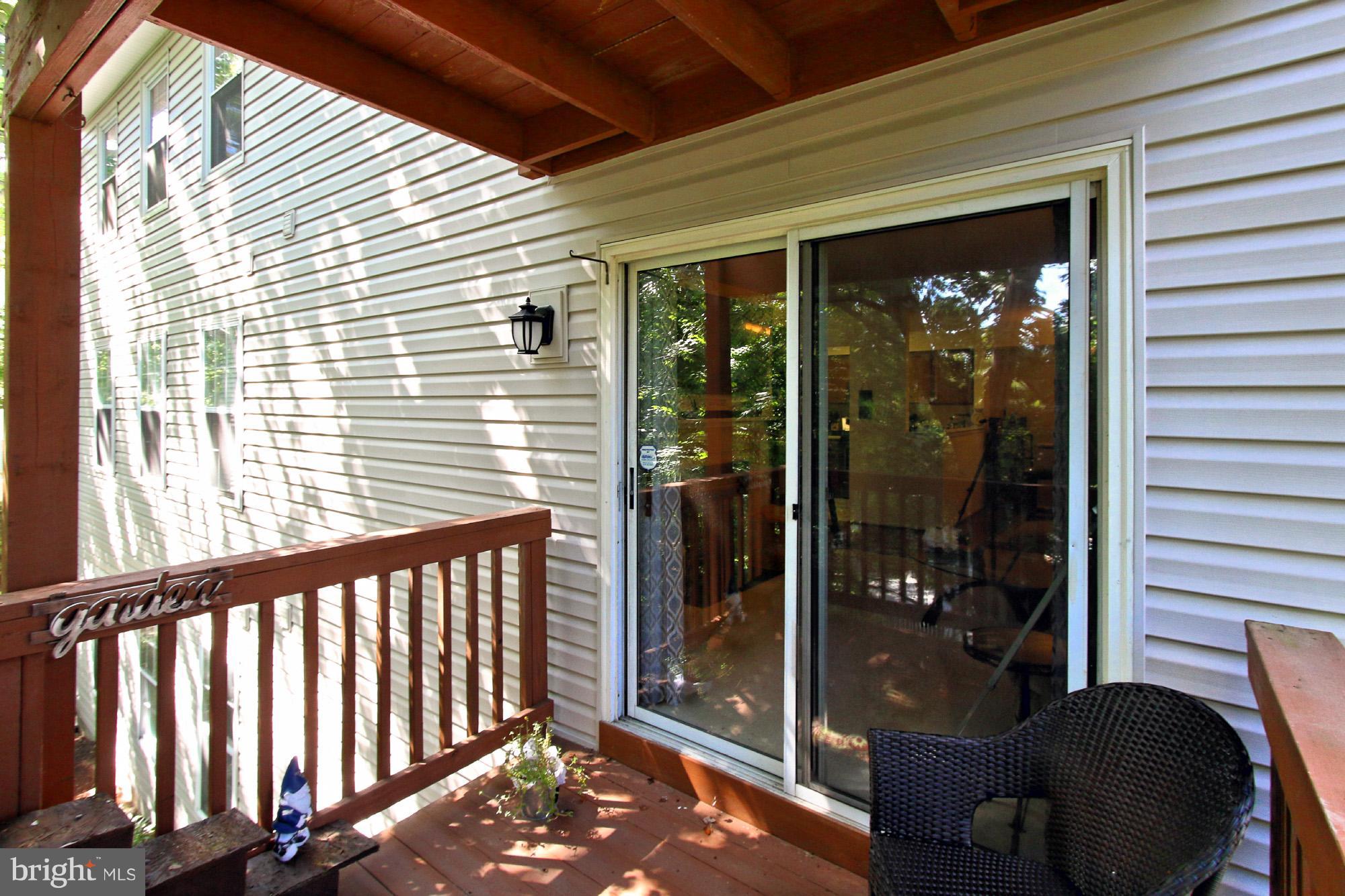 7705 Lexton Place, Unit C Springfield, VA 22152 - Photo 24 of 29 Sliding glass door entry from the living room
