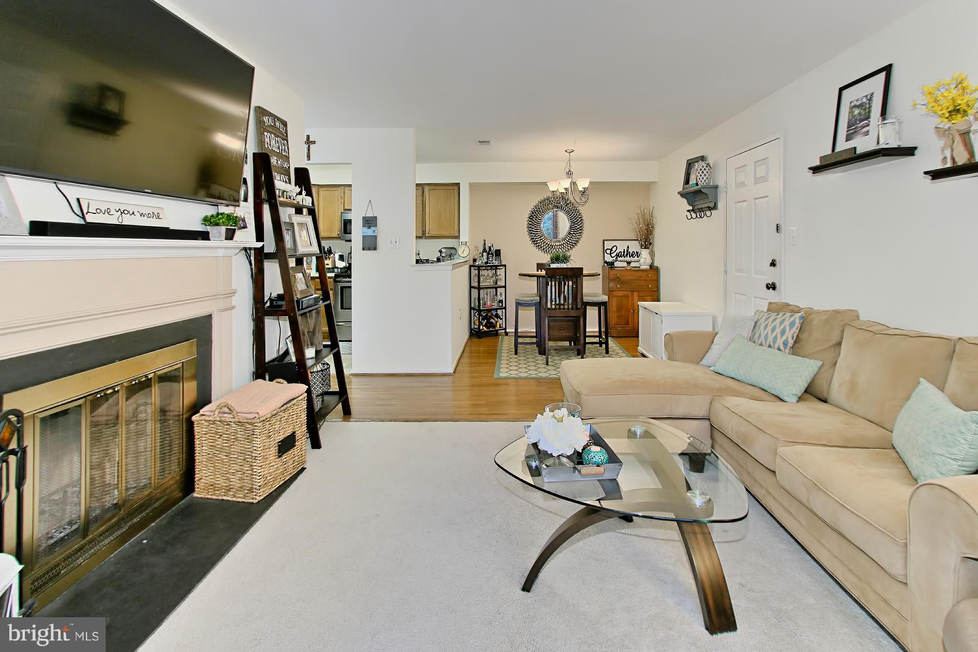 7705 Lexton Place, Unit C Springfield, VA 22152 - Photo 9 of 29 Living Room is open to the dining room and kitchen