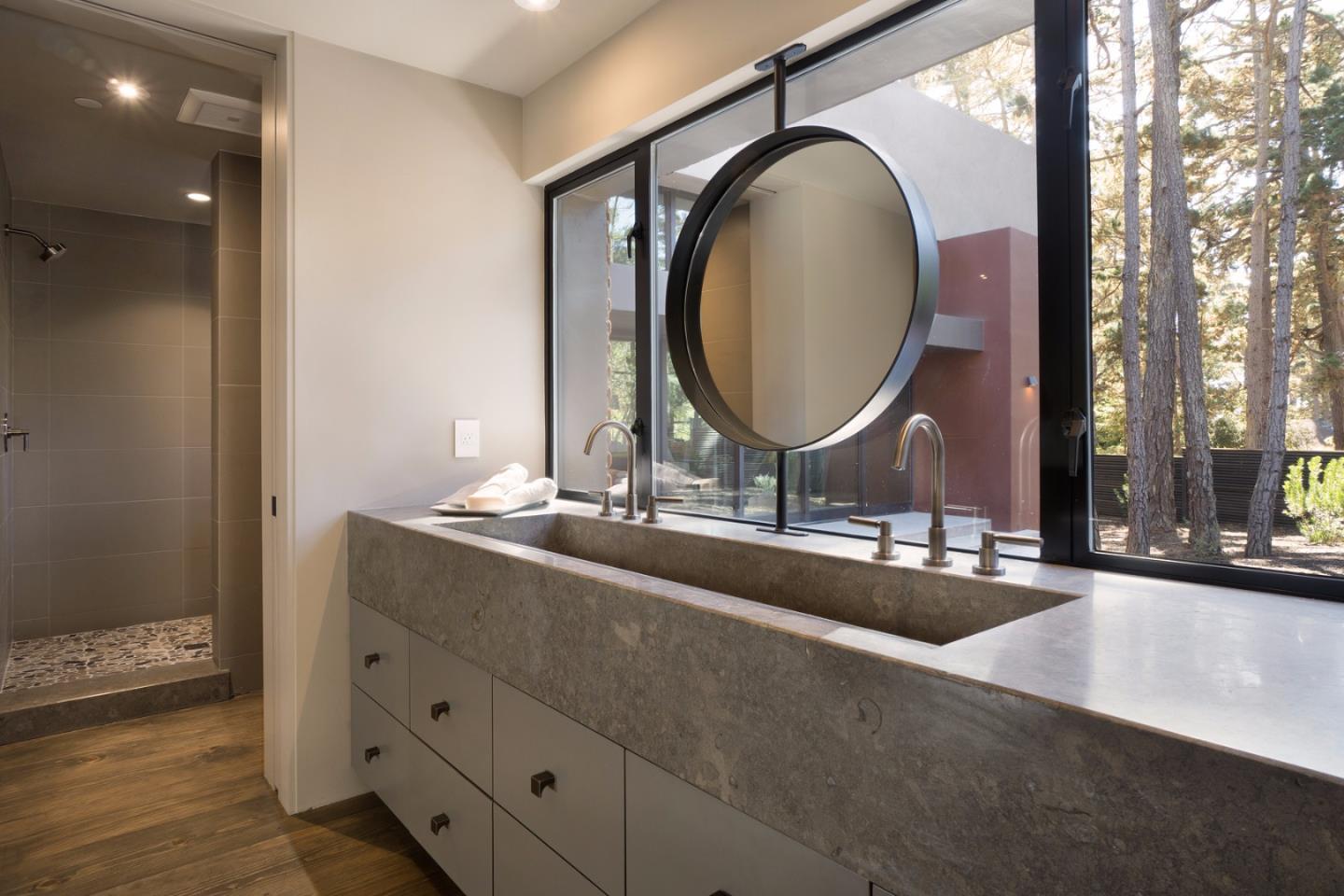 4064 Ronda Road Pebble Beach, CA 93953 - Photo 14 of 19 a bathroom with a double vanity sink and a mirror