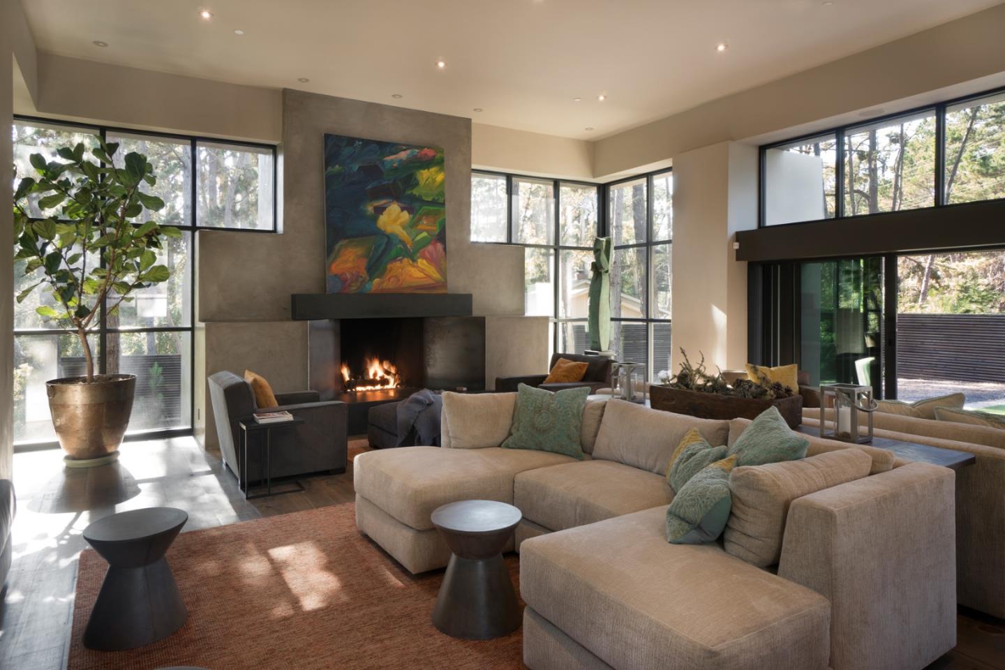 4064 Ronda Road Pebble Beach, CA 93953 - Photo 5 of 19 a living room with furniture large window and fireplace