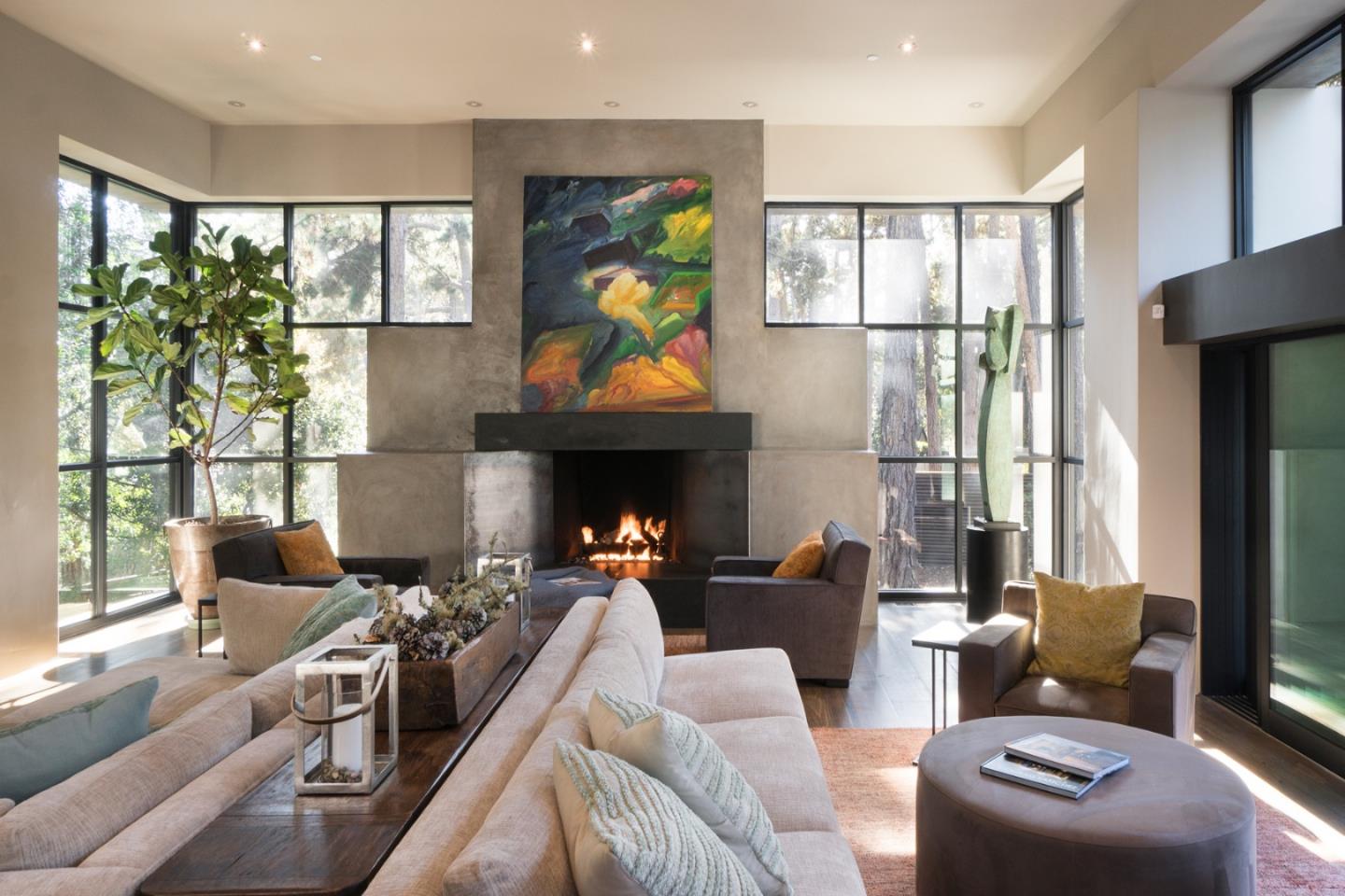 4064 Ronda Road Pebble Beach, CA 93953 - Photo 6 of 19 a living room with furniture a floor to ceiling window and a fireplace