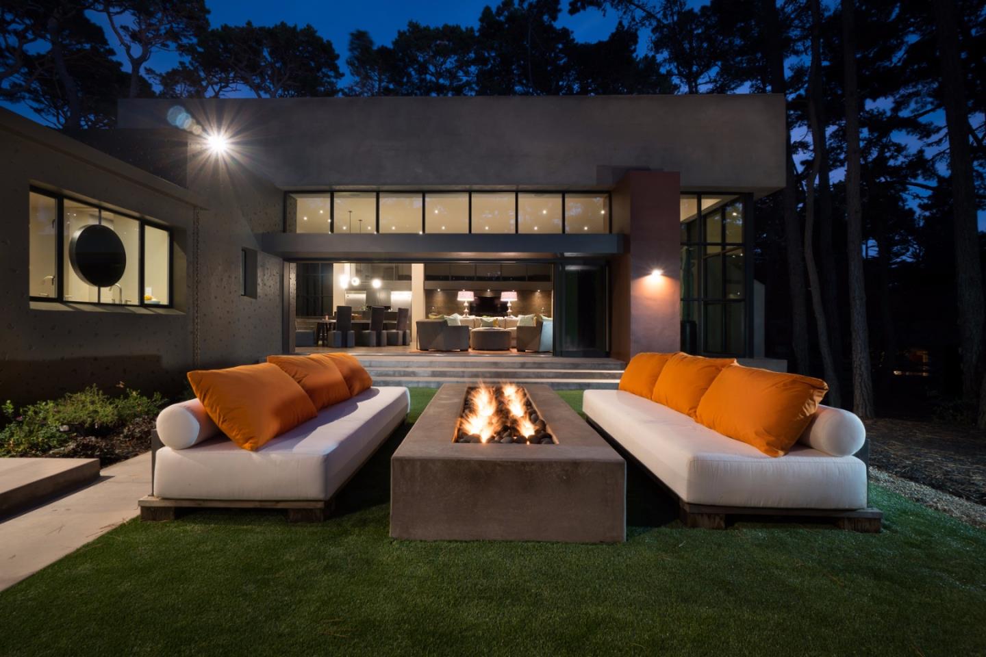 4064 Ronda Road Pebble Beach, CA 93953 - Photo 9 of 19 a outdoor space with patio couches and a fireplace
