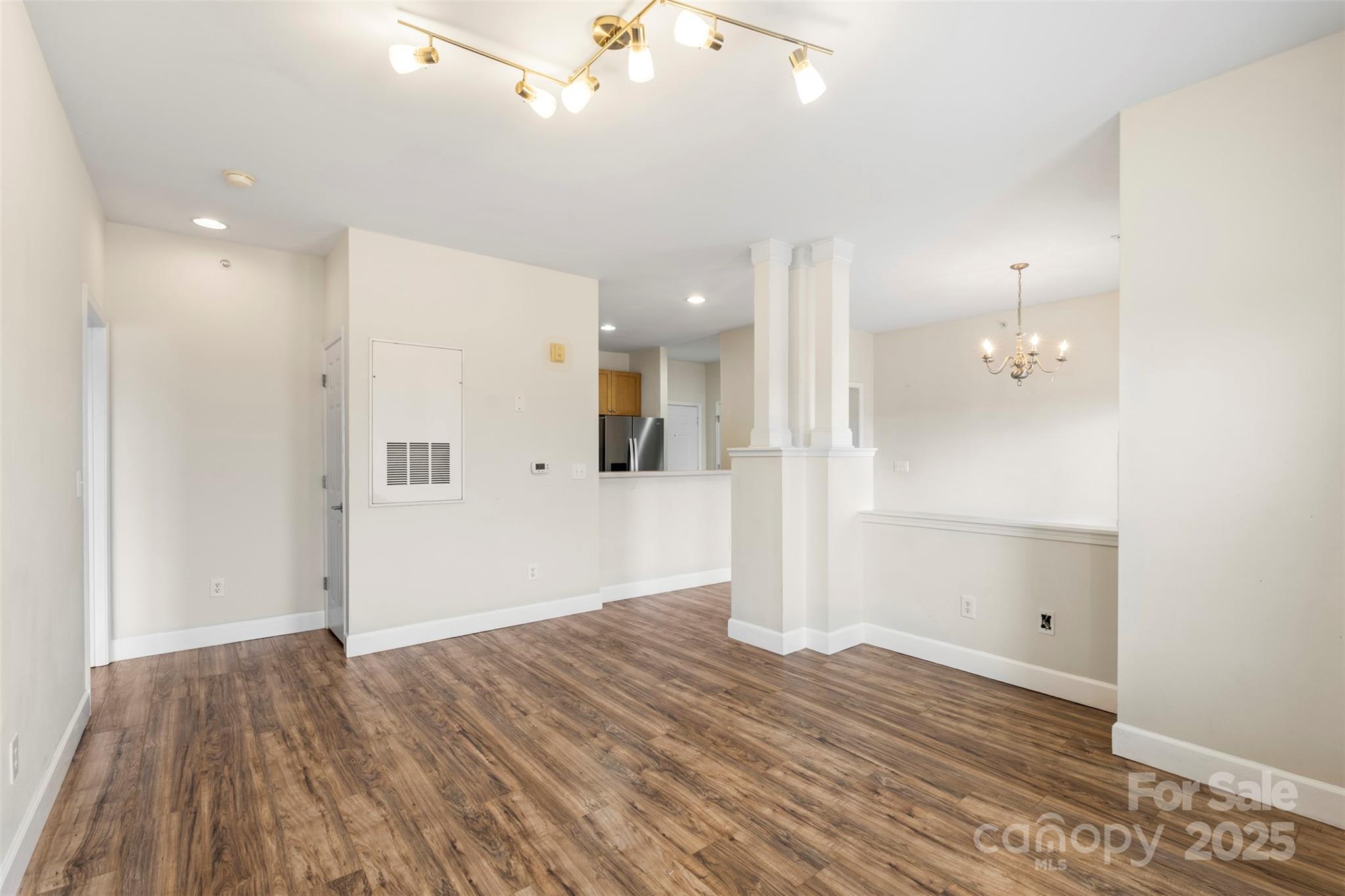 3805 Balsam Street, Unit 321 Indian Trail, NC 28079 - Photo 14 of 47 wooden floor in an empty room with a window