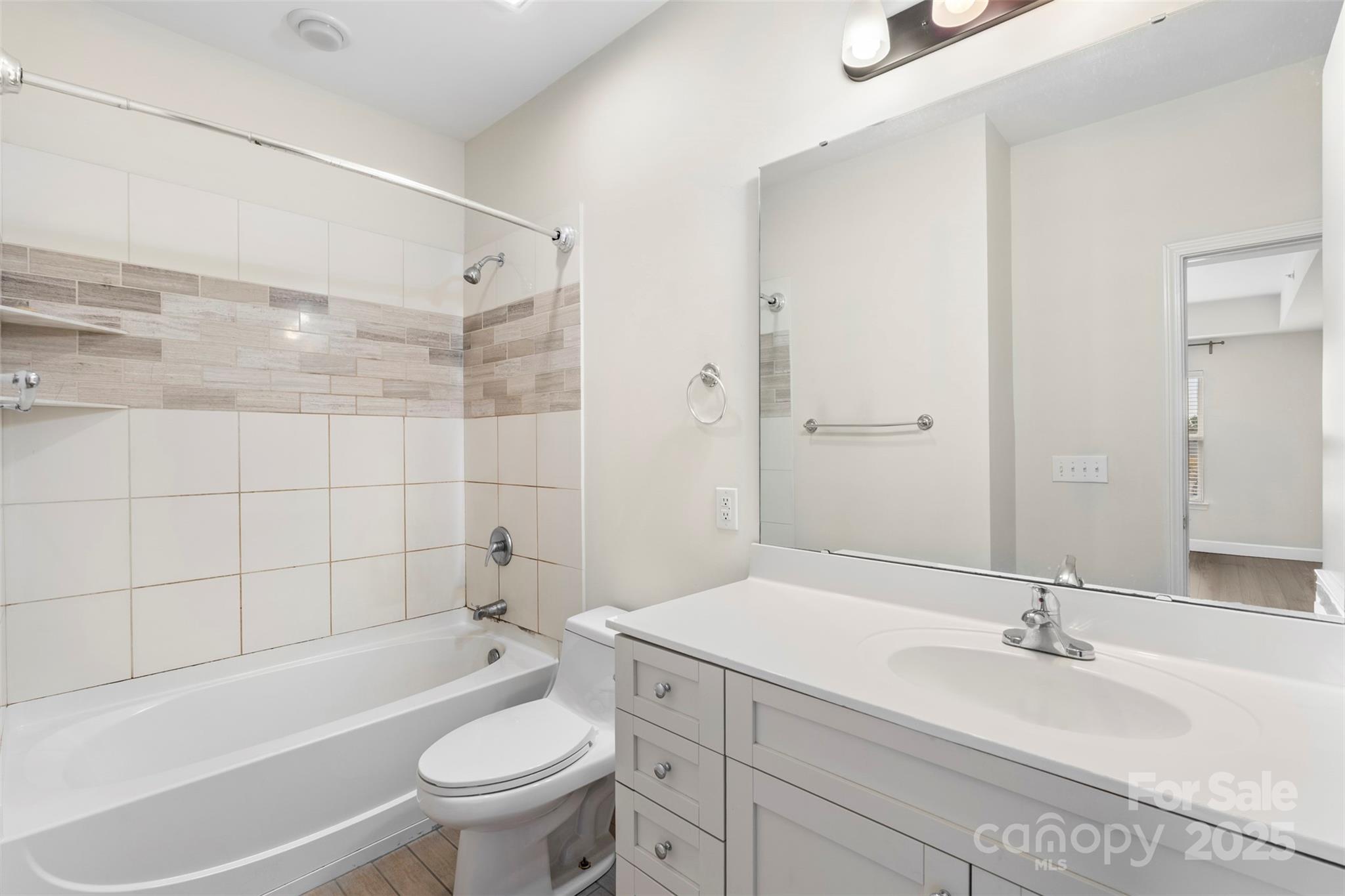 3805 Balsam Street, Unit 321 Indian Trail, NC 28079 - Photo 20 of 47 a bathroom with a sink a toilet and a bathtub