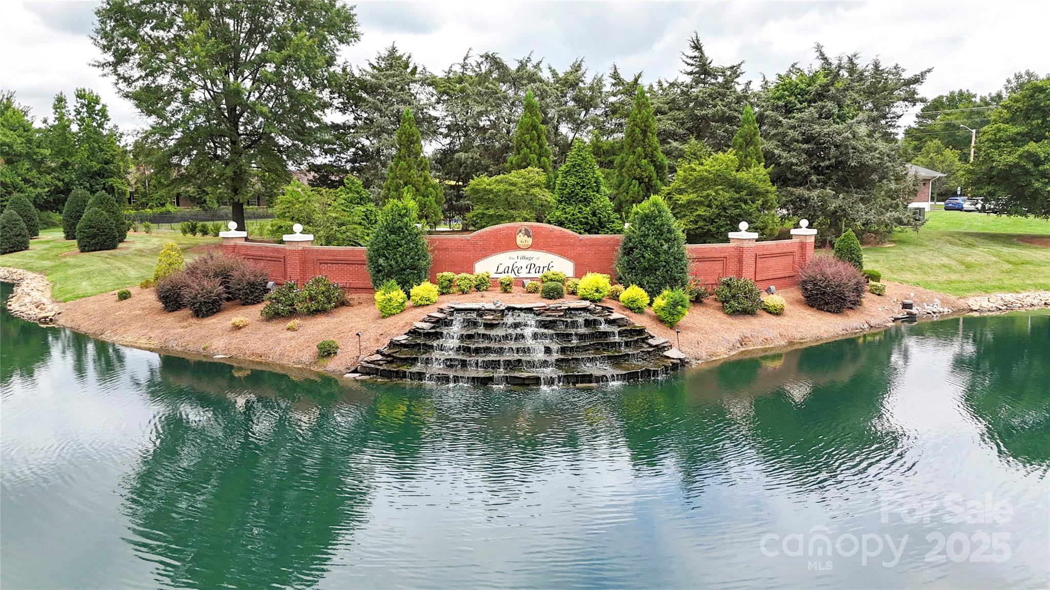 3805 Balsam Street, Unit 321 Indian Trail, NC 28079 - Photo 29 of 47 a view of house with outdoor space and lake view