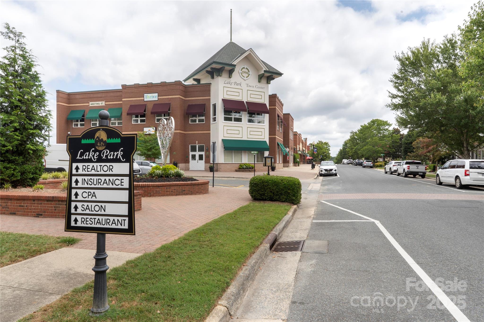 3805 Balsam Street, Unit 321 Indian Trail, NC 28079 - Photo 39 of 47 a sign board with buildings in the background