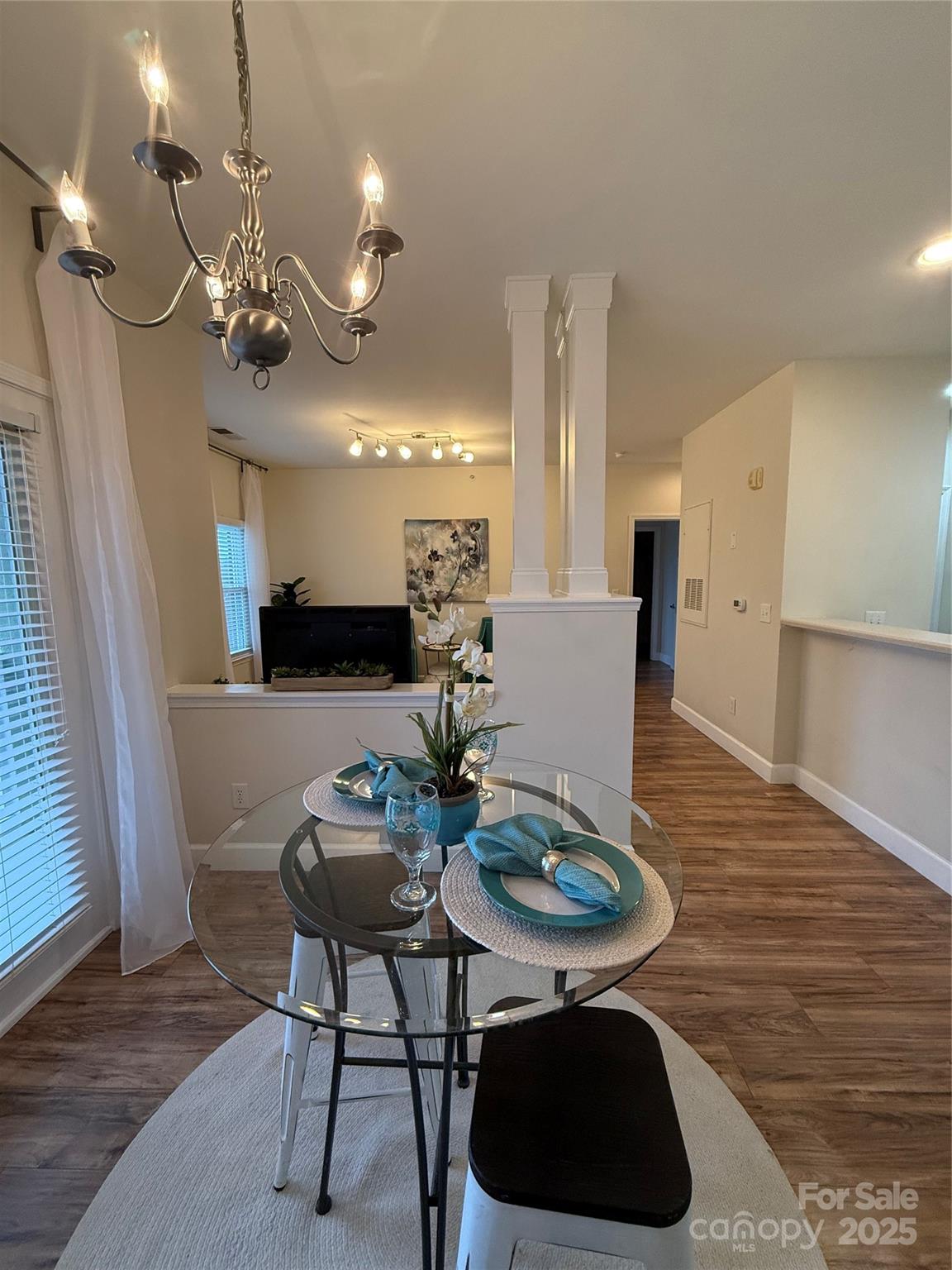 3805 Balsam Street, Unit 321 Indian Trail, NC 28079 - Photo 42 of 47 a view of a dining room with furniture and wooden floor