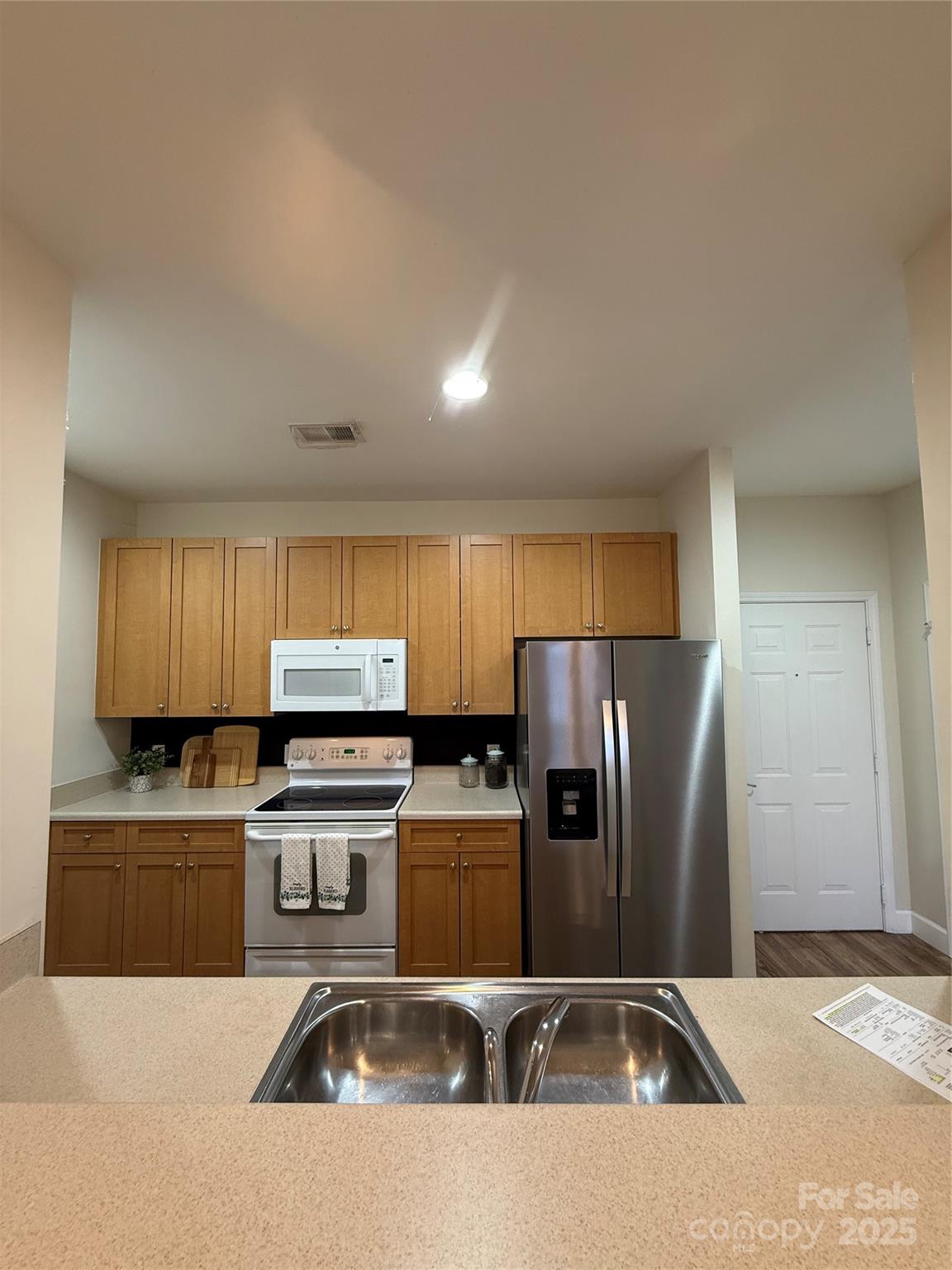 3805 Balsam Street, Unit 321 Indian Trail, NC 28079 - Photo 45 of 47 a kitchen with a refrigerator sink and stove