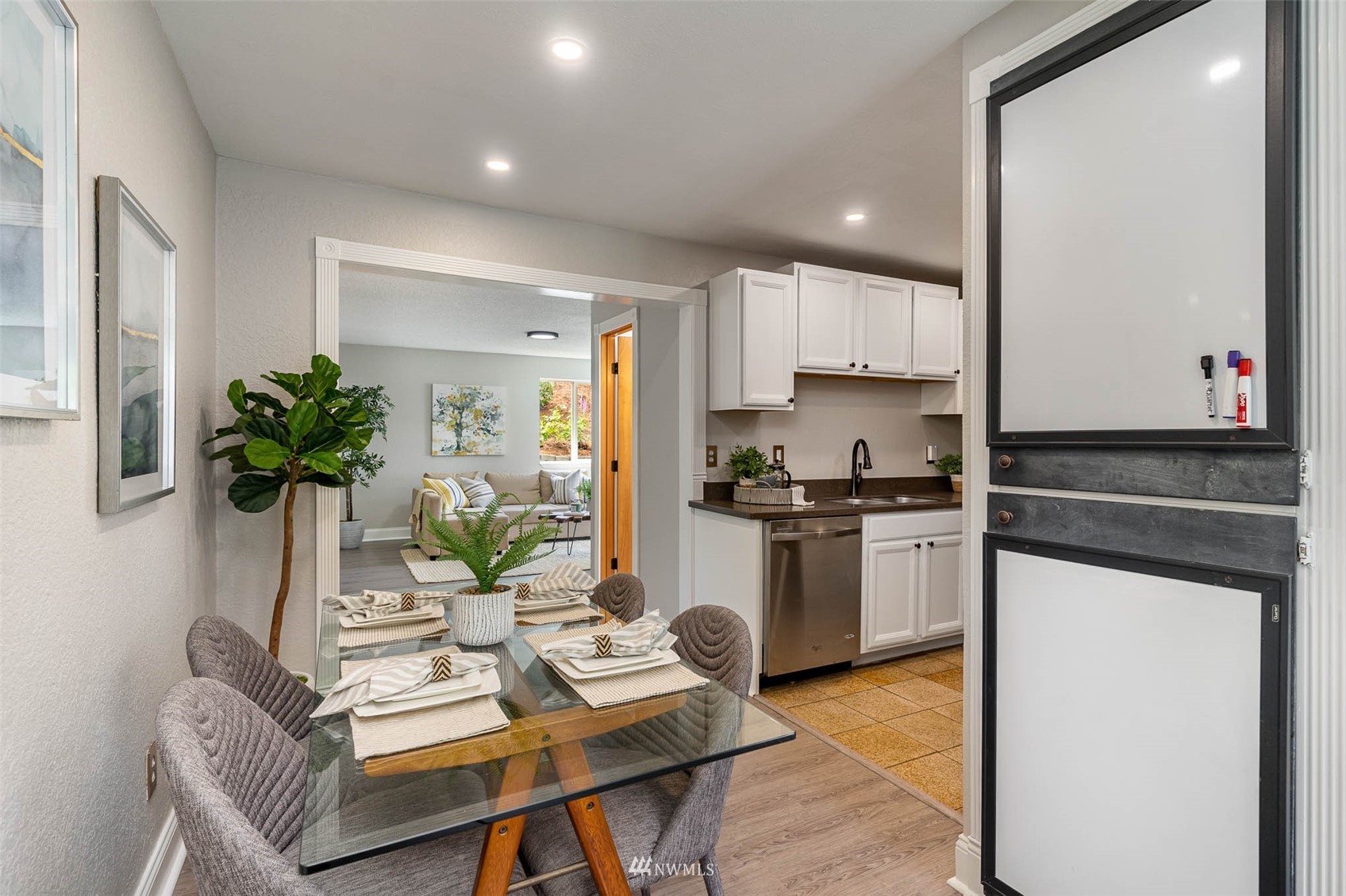 18120 19th Drive Southeast Bothell, WA 98012 - Photo 12 of 31 a living room with kitchen island furniture a potted plant and a sink