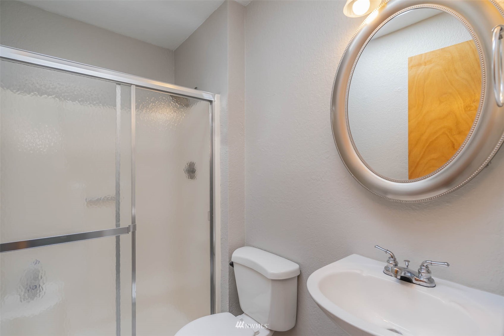 18120 19th Drive Southeast Bothell, WA 98012 - Photo 13 of 31 a bathroom with a sink and a mirror