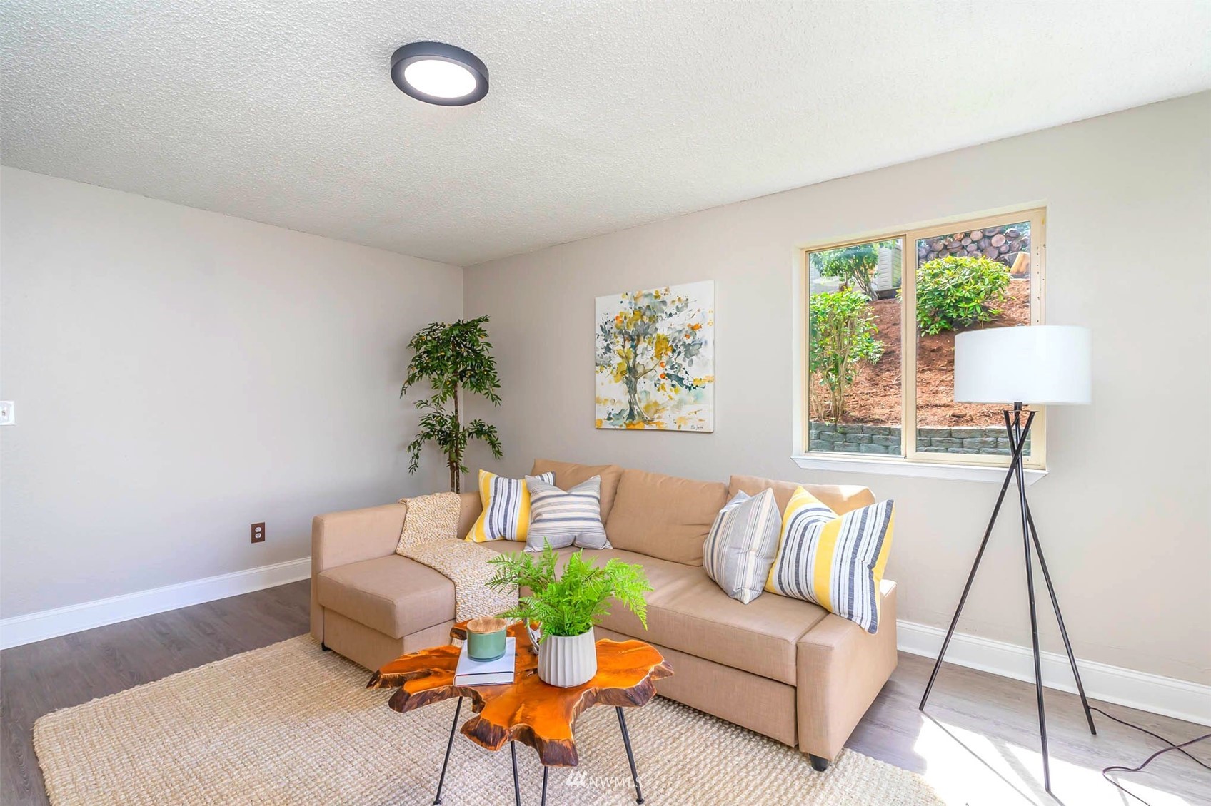 18120 19th Drive Southeast Bothell, WA 98012 - Photo 16 of 31 a living room with furniture and a potted plant