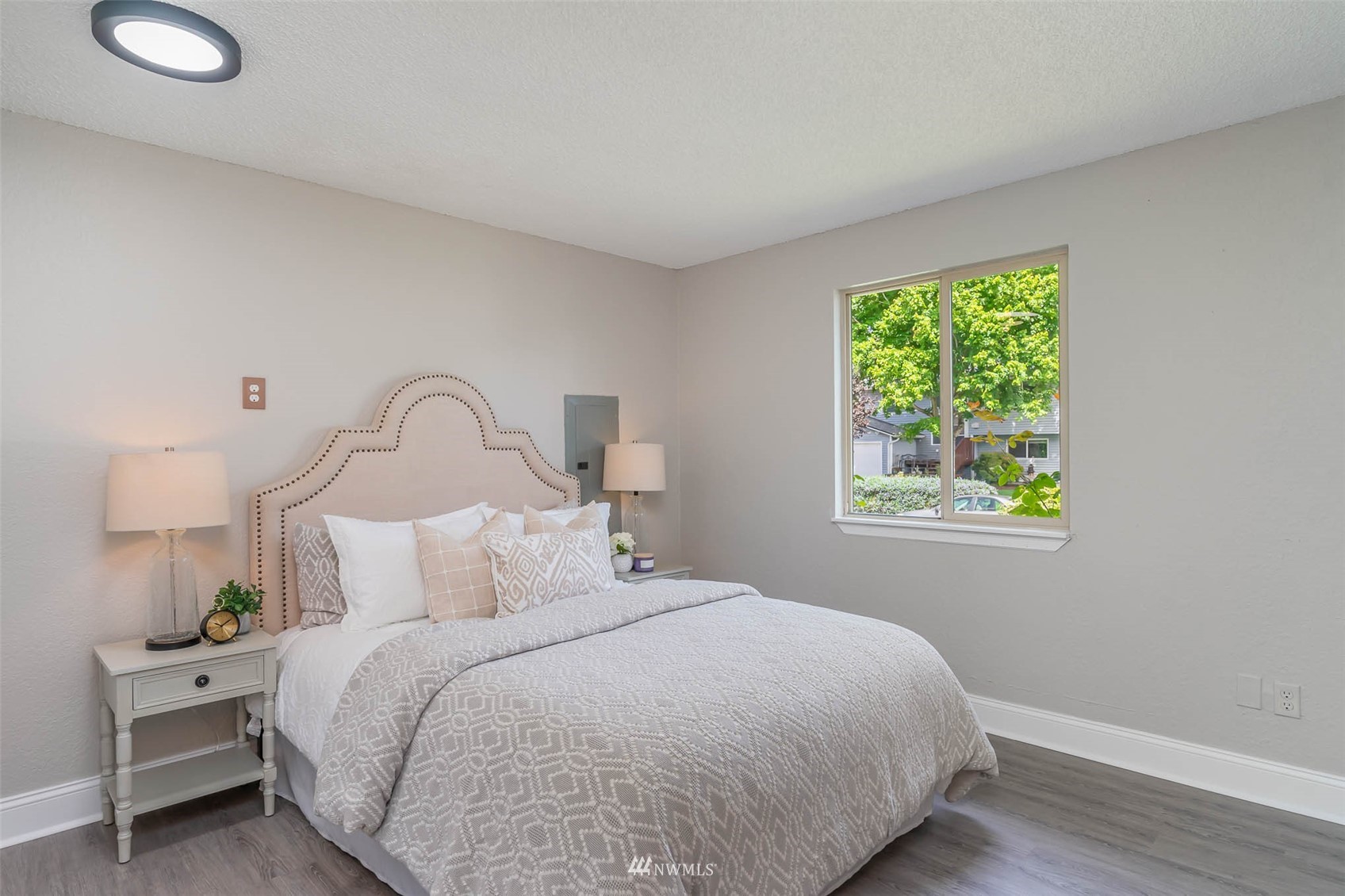 18120 19th Drive Southeast Bothell, WA 98012 - Photo 20 of 31 a bedroom with a bed and a lamp