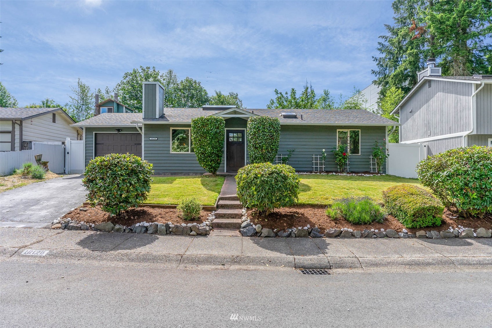 18120 19th Drive Southeast Bothell, WA 98012 - Photo 2 of 31 a front view of a house with a yard and potted plants