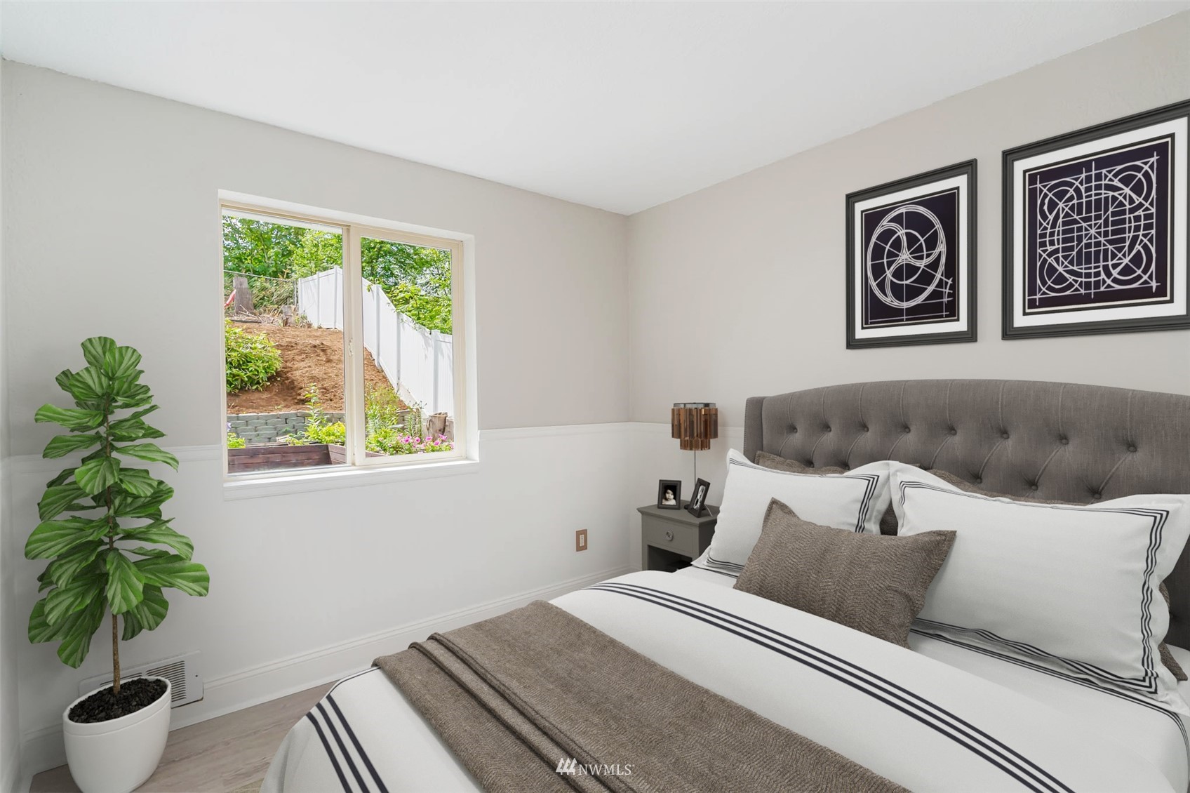 18120 19th Drive Southeast Bothell, WA 98012 - Photo 23 of 31 a bedroom with a large bed and a potted plant